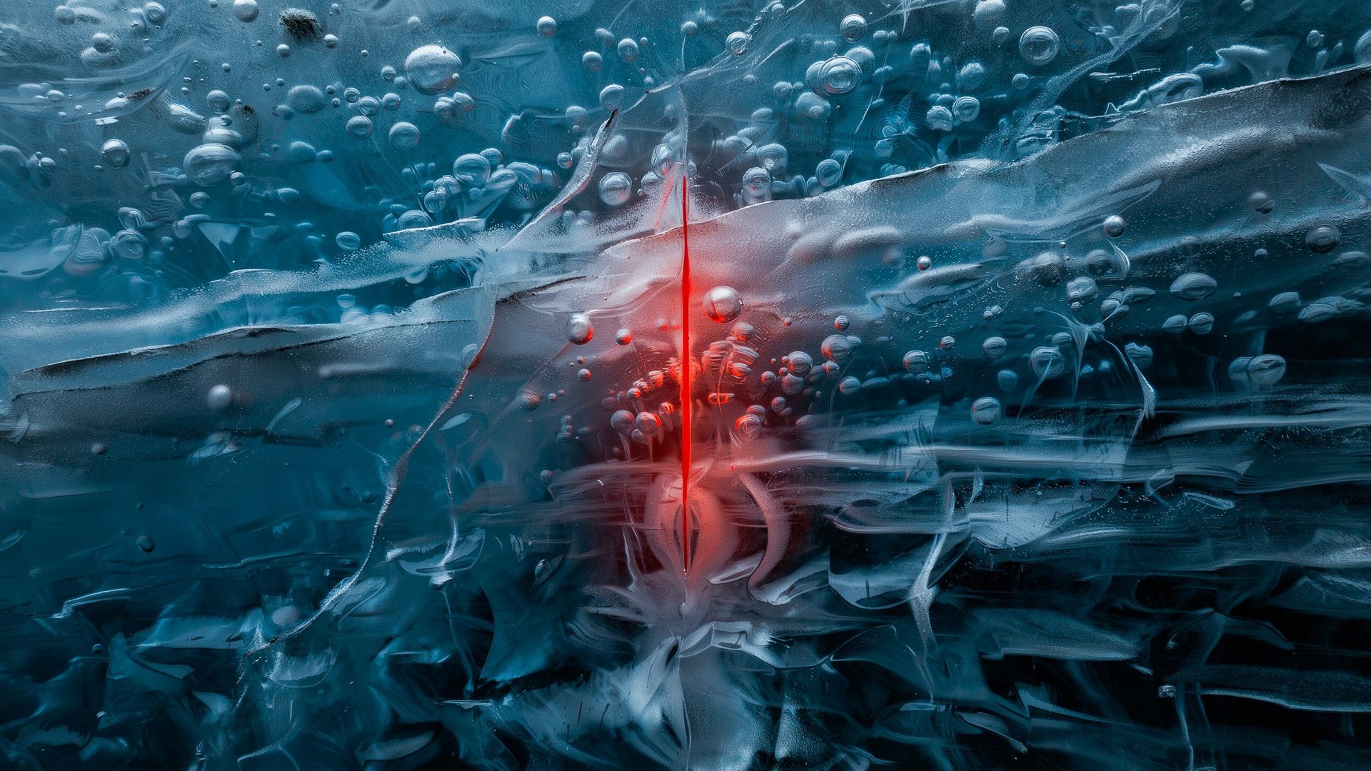 Deep blue glacial ice in close-up, a thin vertical crimson light glowing from within